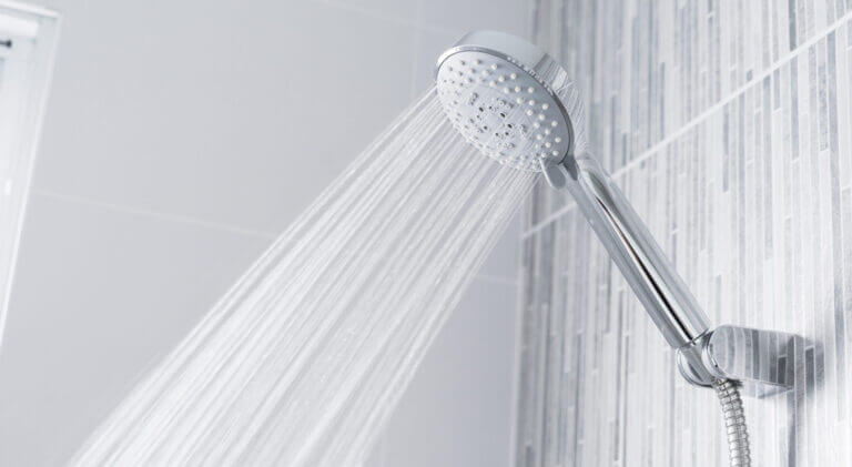bathroom shower head spraying water