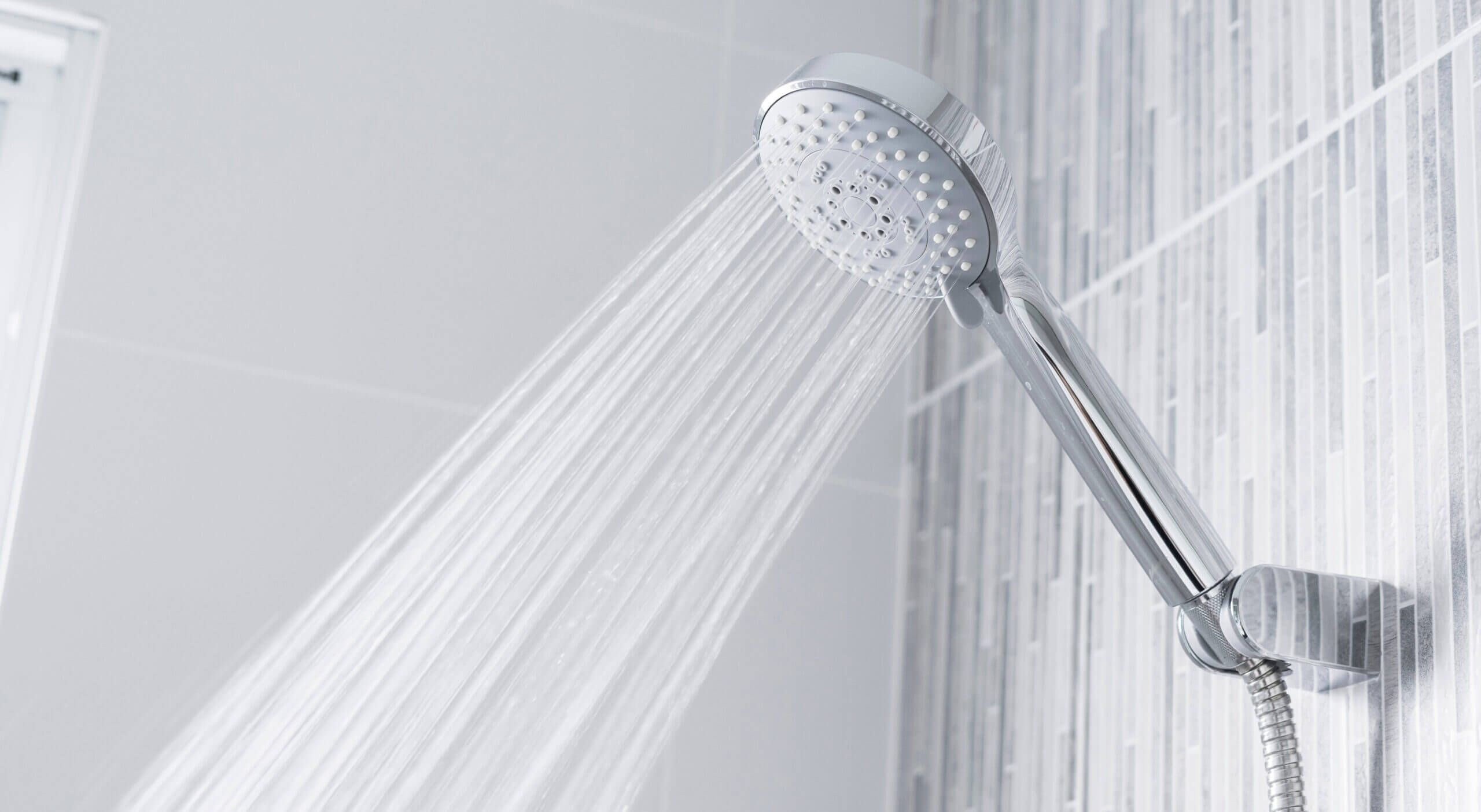 bathroom shower head spraying water